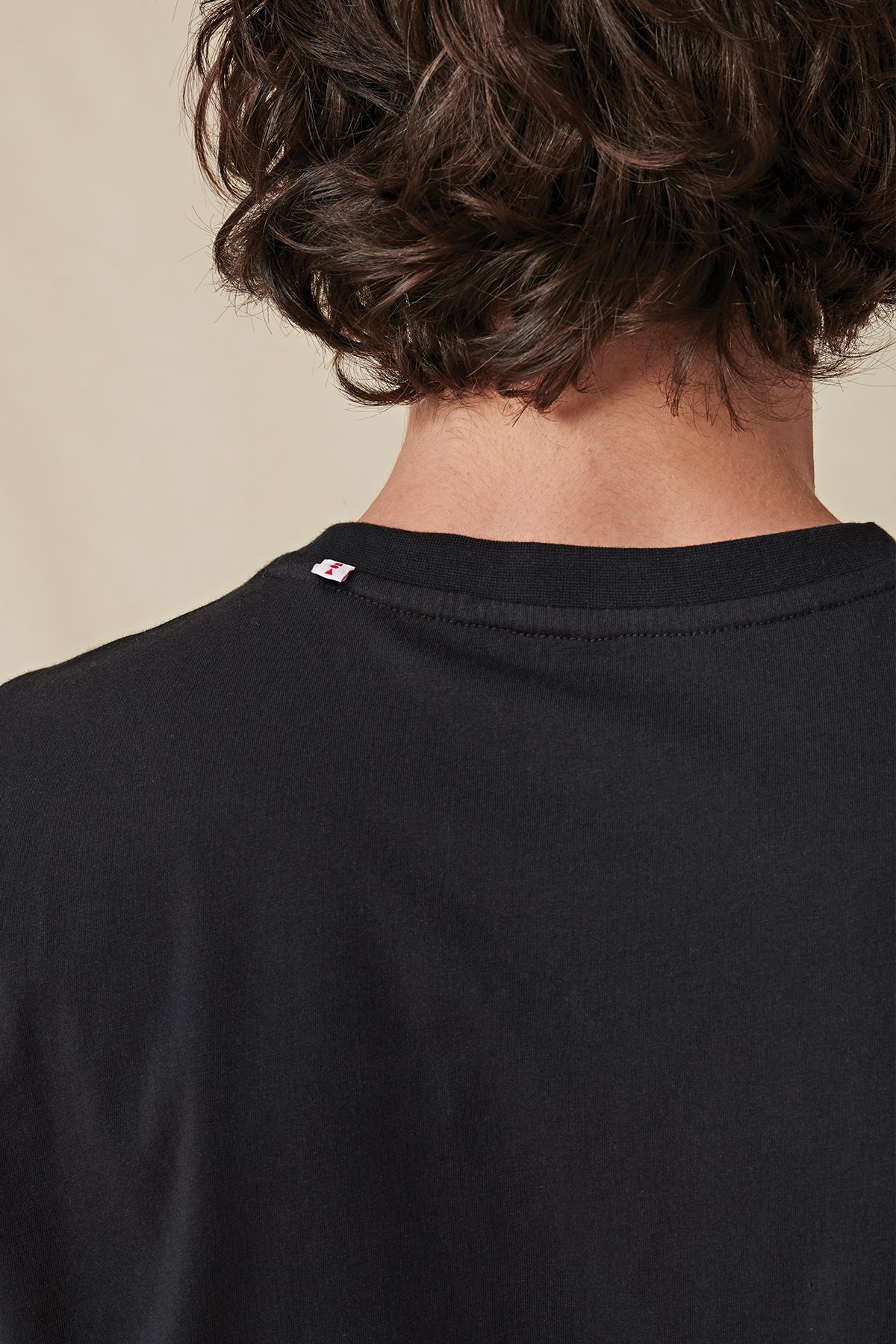 back collar view of Black Globe Brand tee