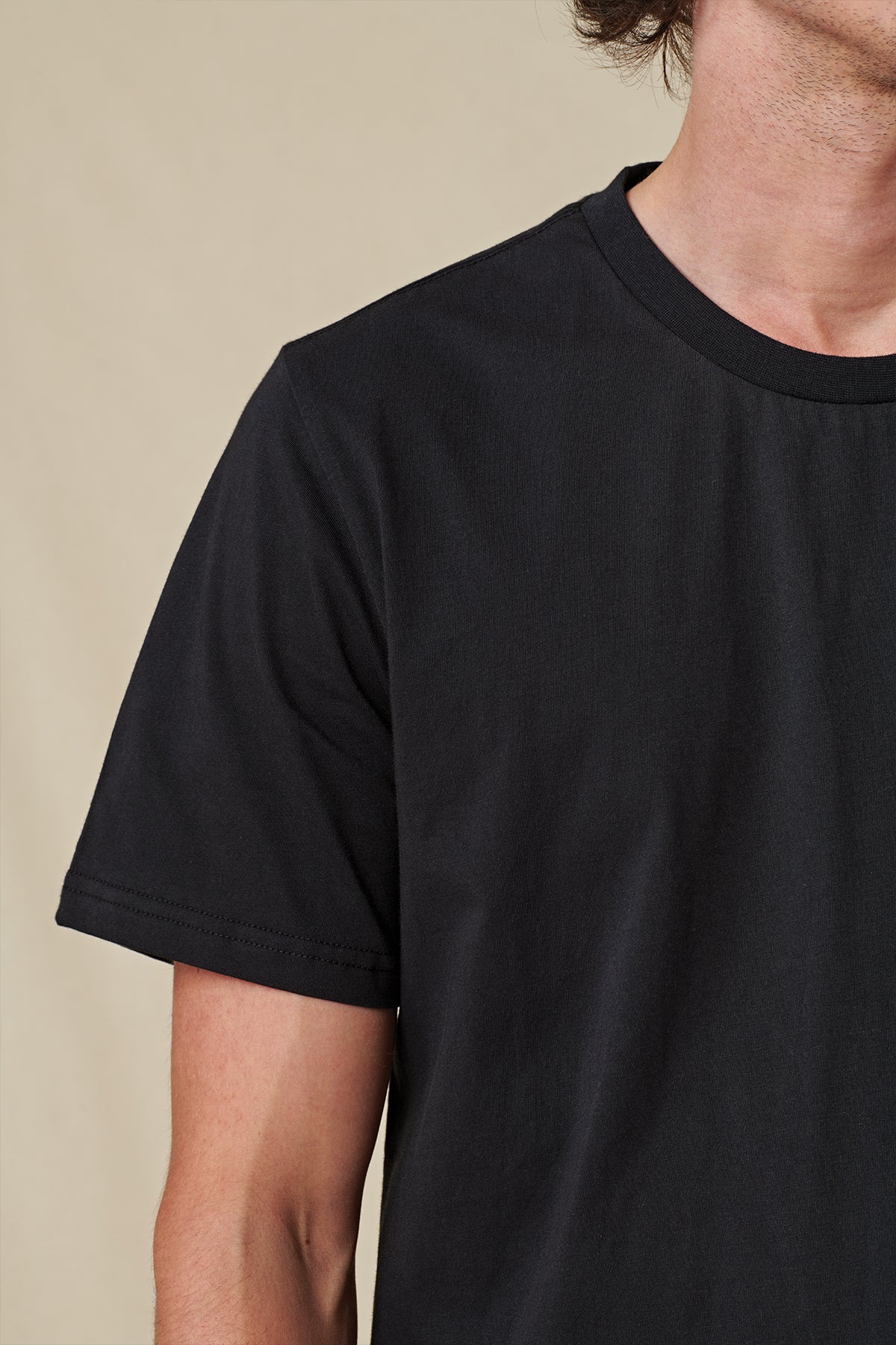 front view of shoulder of Black Globe Brand tee