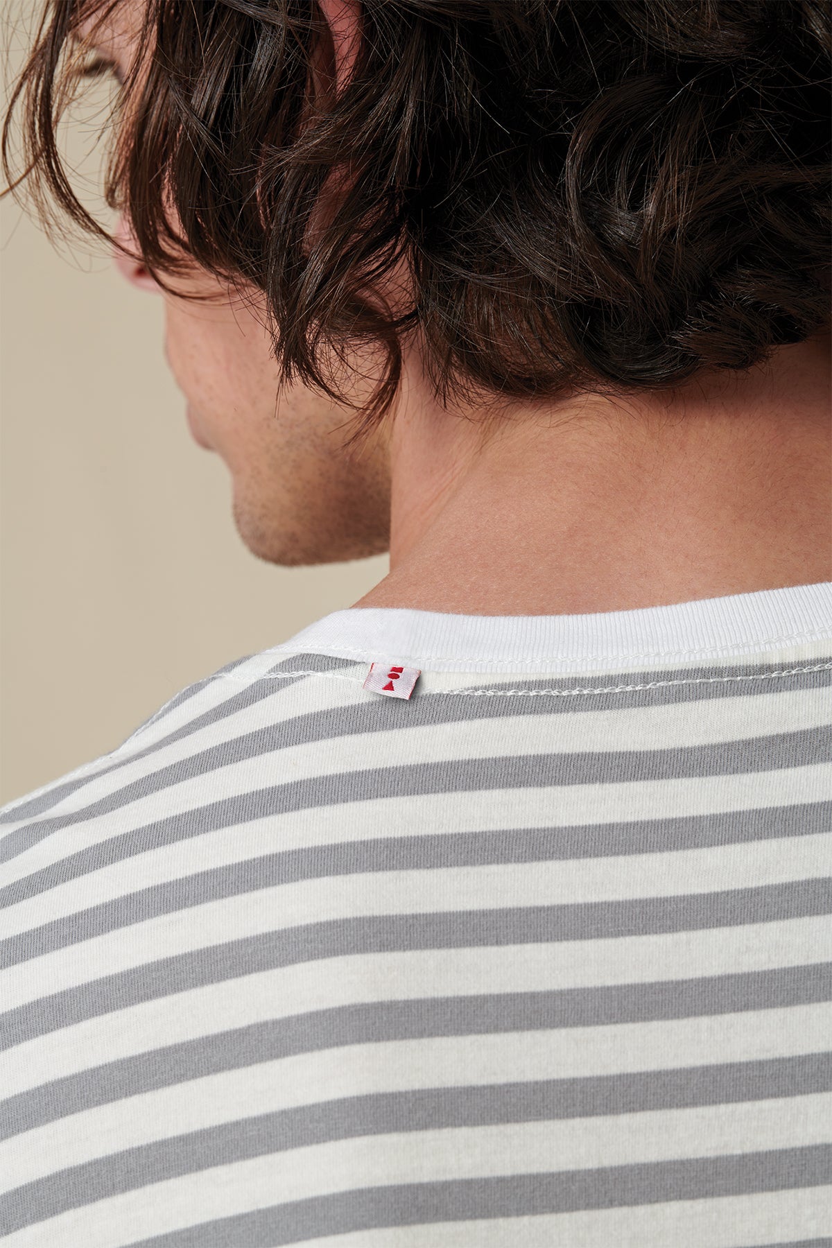 back collar of Globe white striped tee