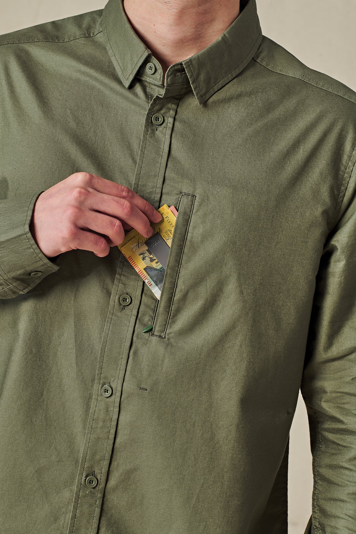 front pocket of Olive long sleeve Globe Button up
