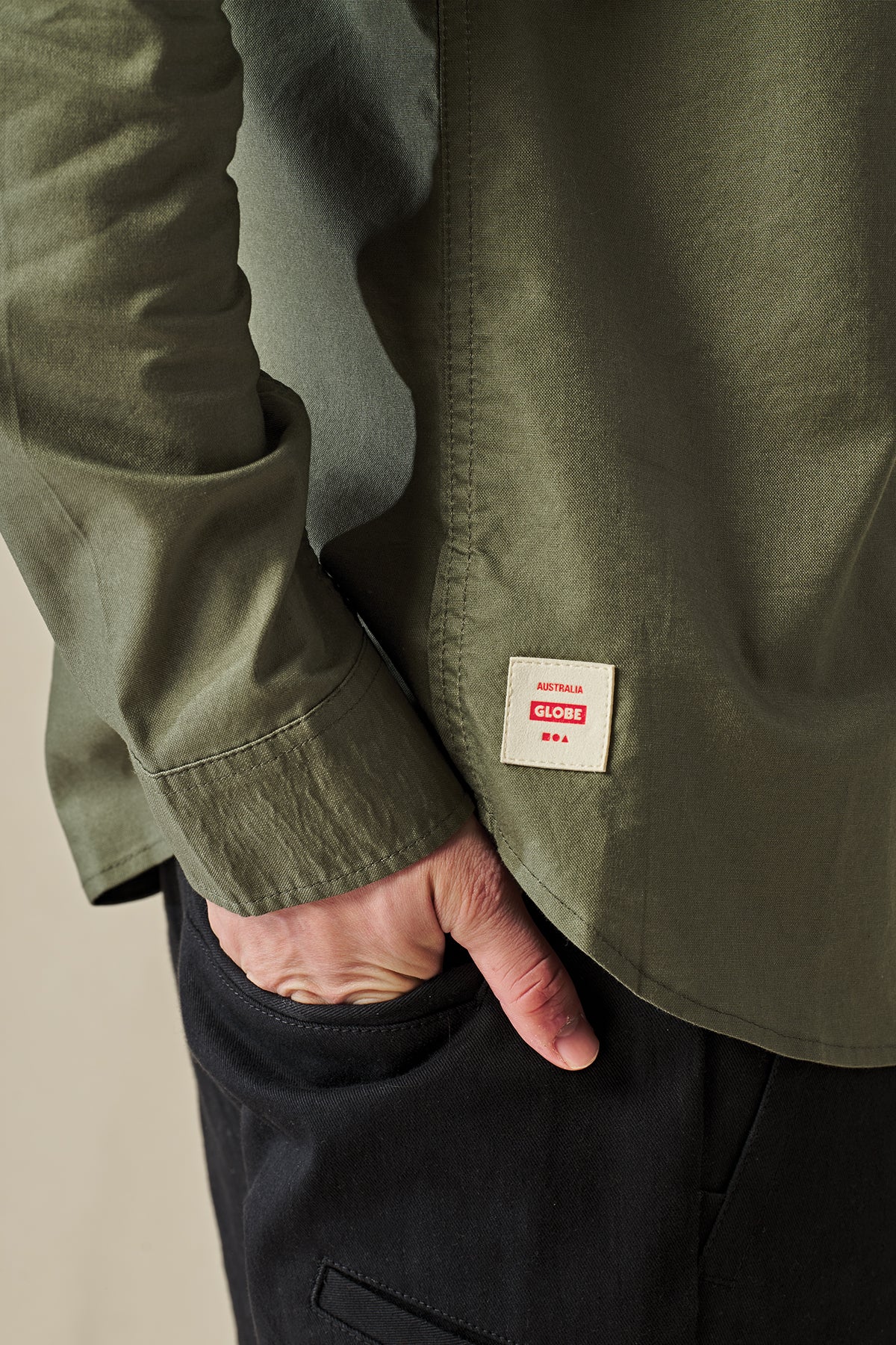 logo detail of Olive long sleeve Globe Button up