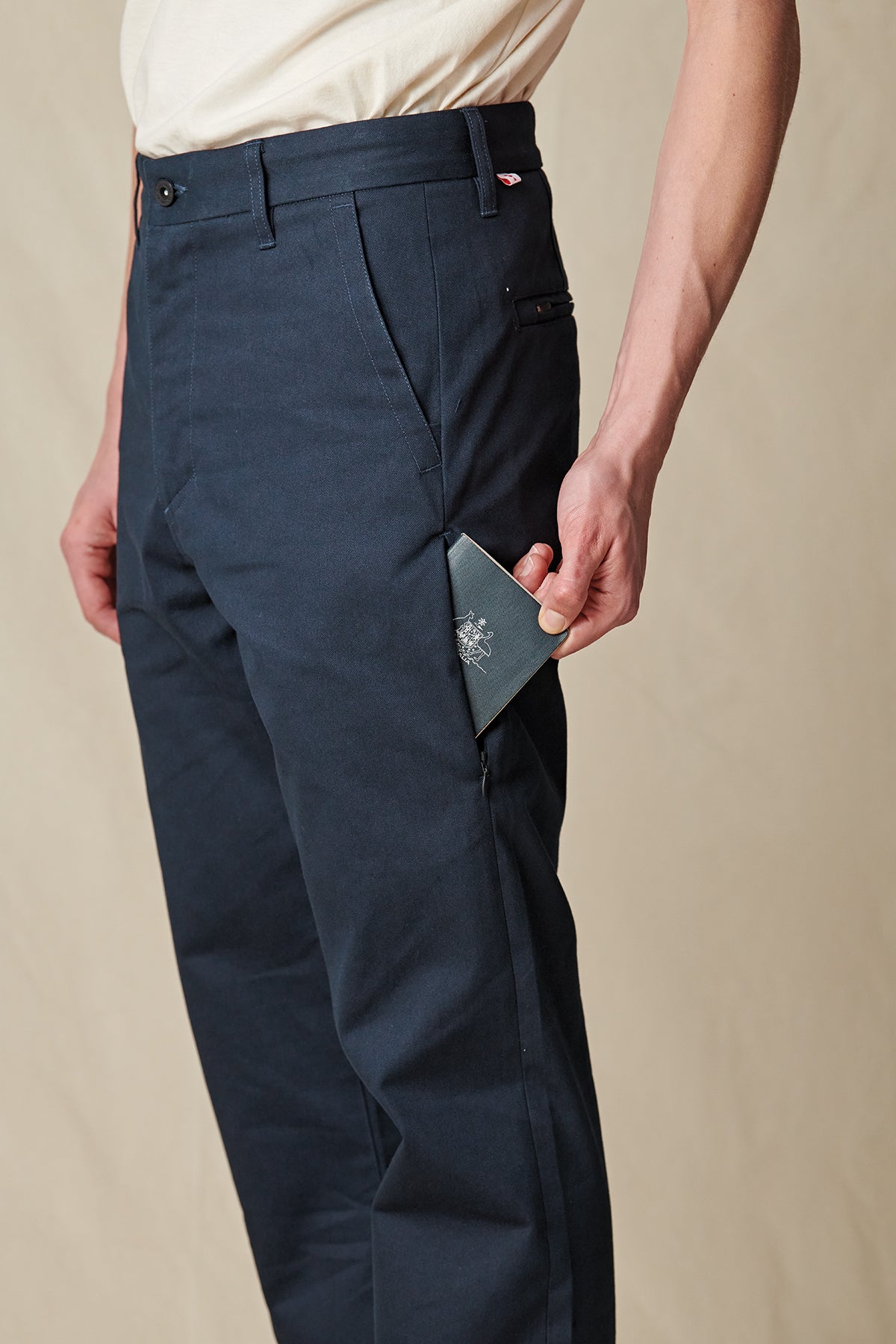 side pocket profile of Navy Globe Pants. 