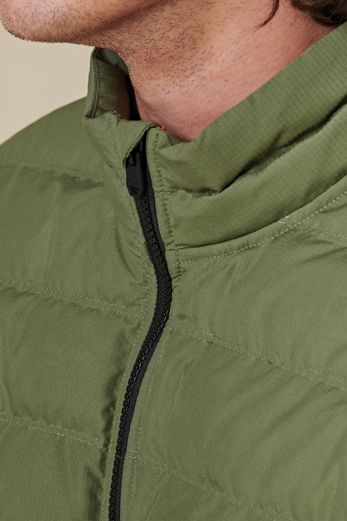 front collar view of Olive Globe Prime Down Jacket