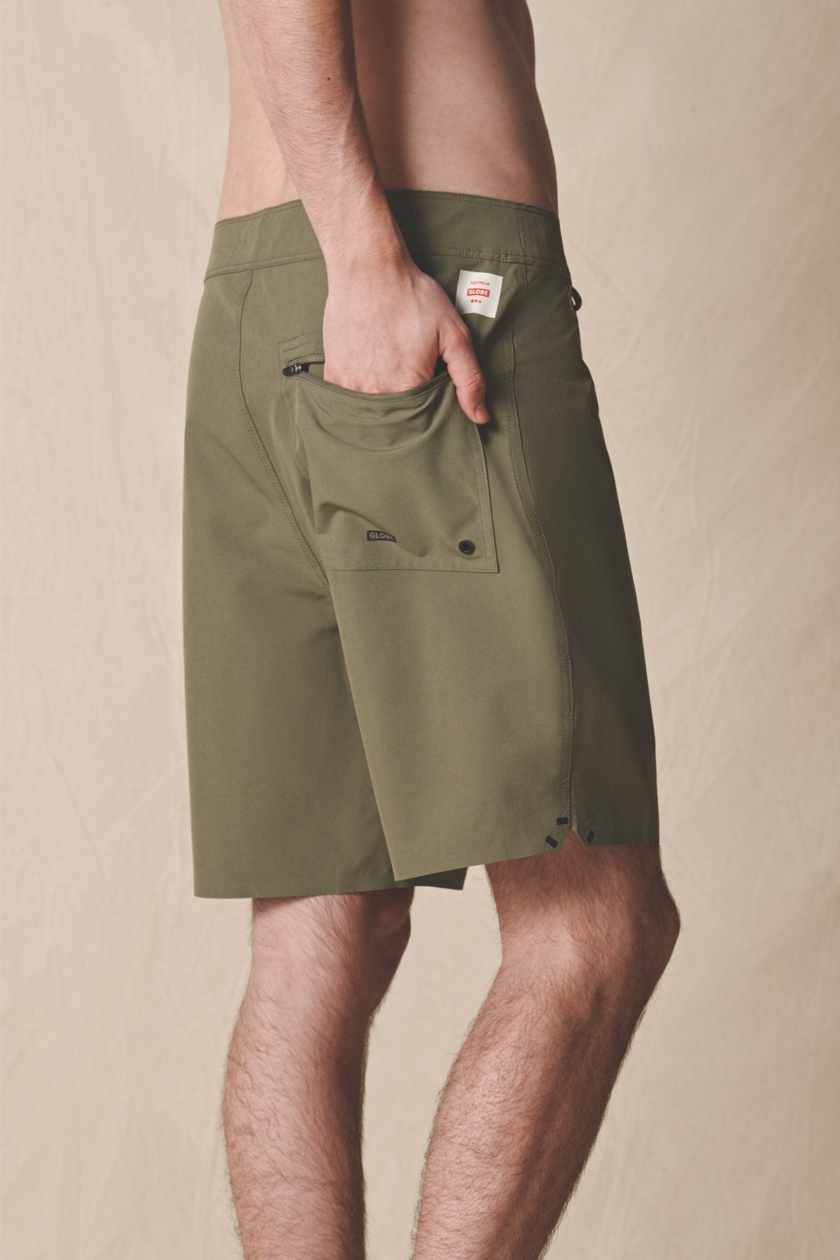 back model in use of Every Swell Boardshort - olive