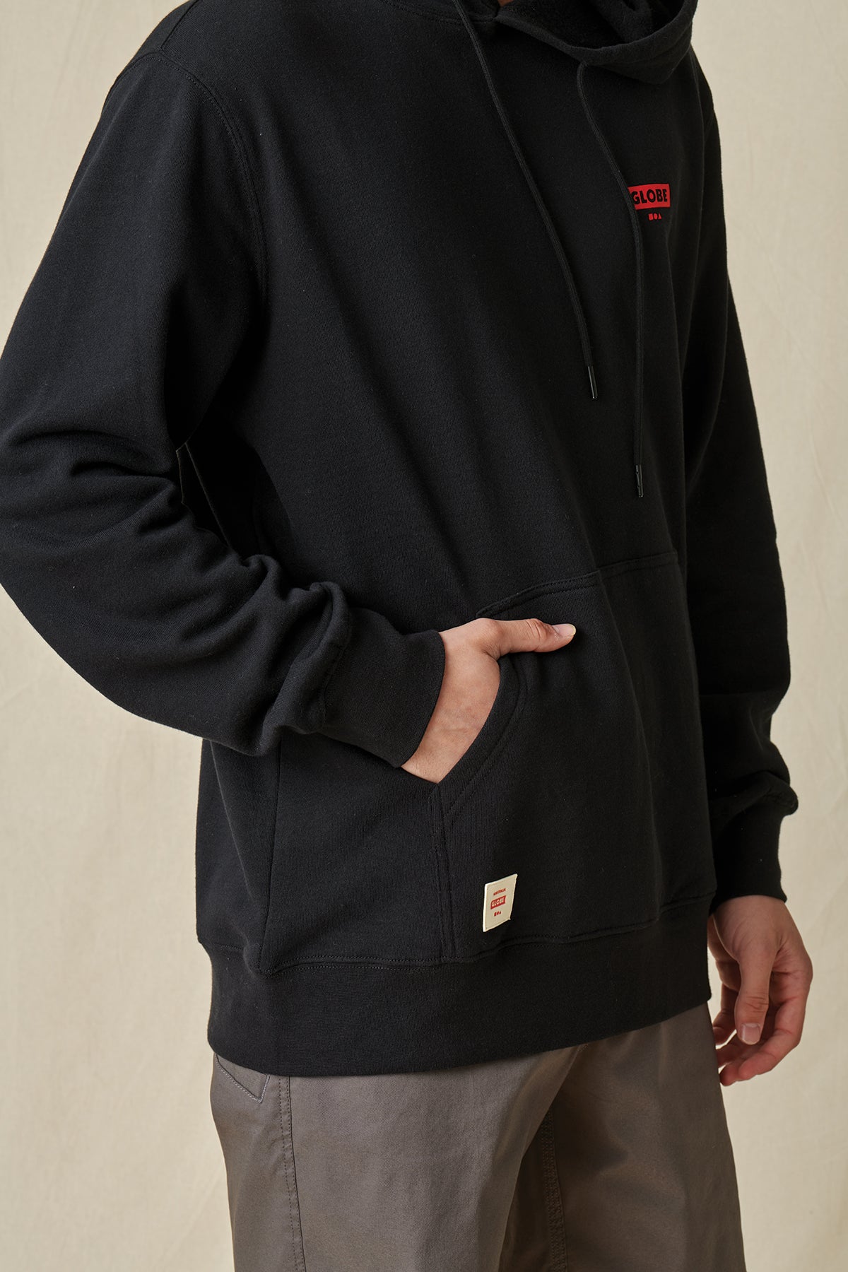 front pocket of Black Living Low Velocity Hoodie