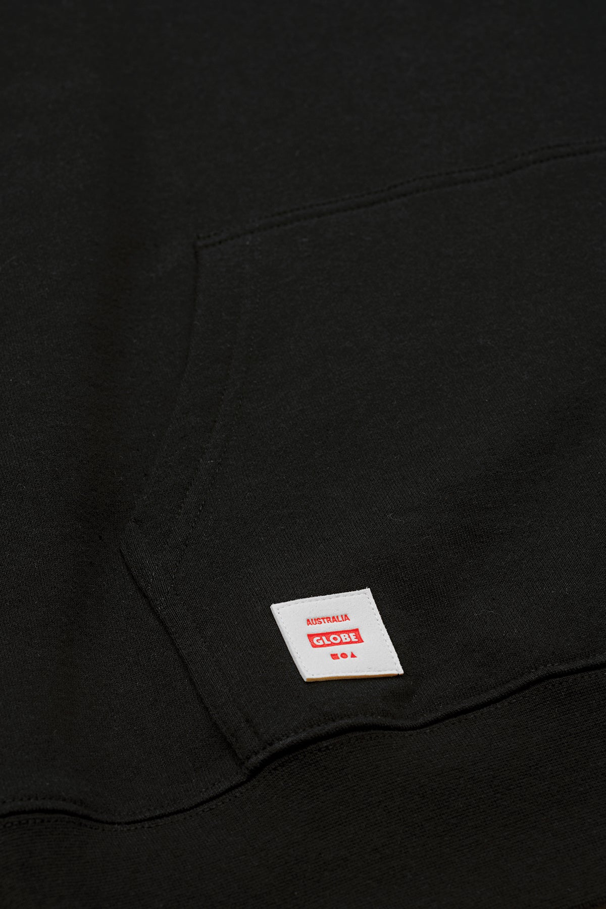 front logo detail of Black Living Low Velocity Hoodie